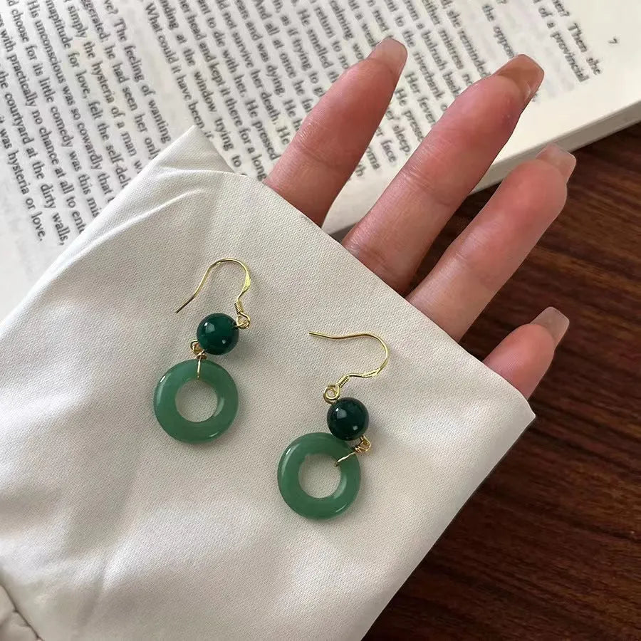 Geometric Chinese peace buckle earrings with green jade design on zinc alloy