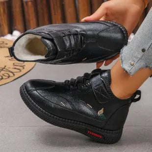 Women's black and red velvet cotton shoes with a hollow-out design and non-slip rubber sole.