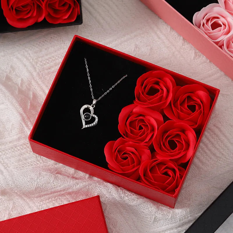 Korean-style gift box open to show six red rose-shaped soap flowers with gift handbag.