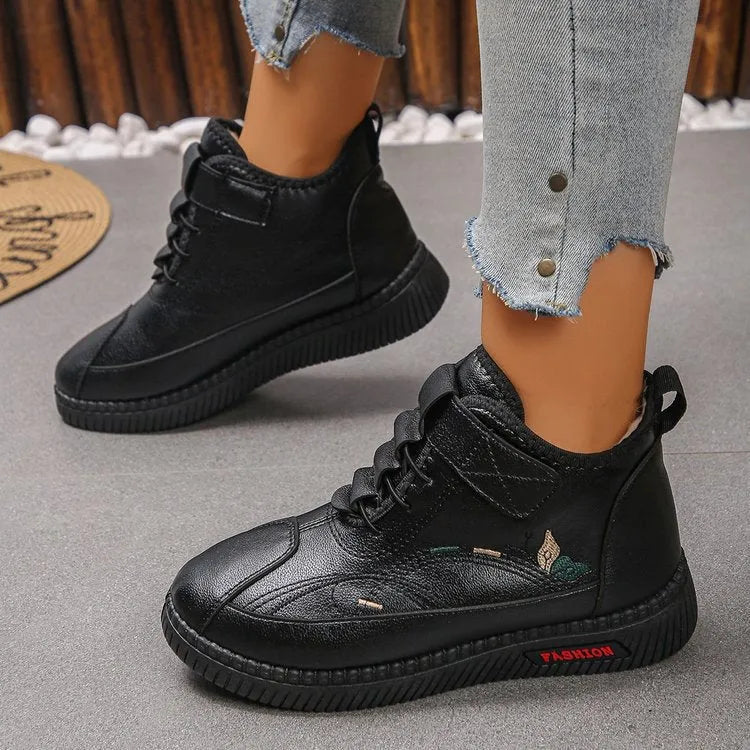 Women's black and red velvet cotton shoes with a hollow-out design and non-slip rubber sole.