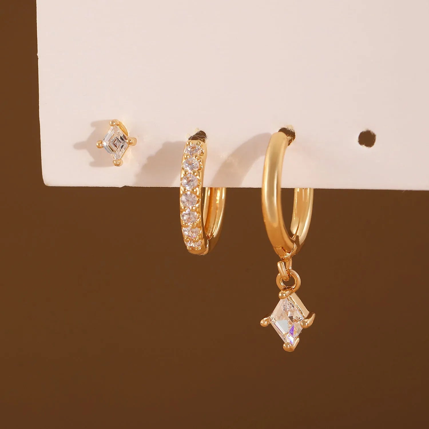 Geometric zircon earring three-piece set showing ear rings, stud earrings, and ear clasps with rhombus patterns