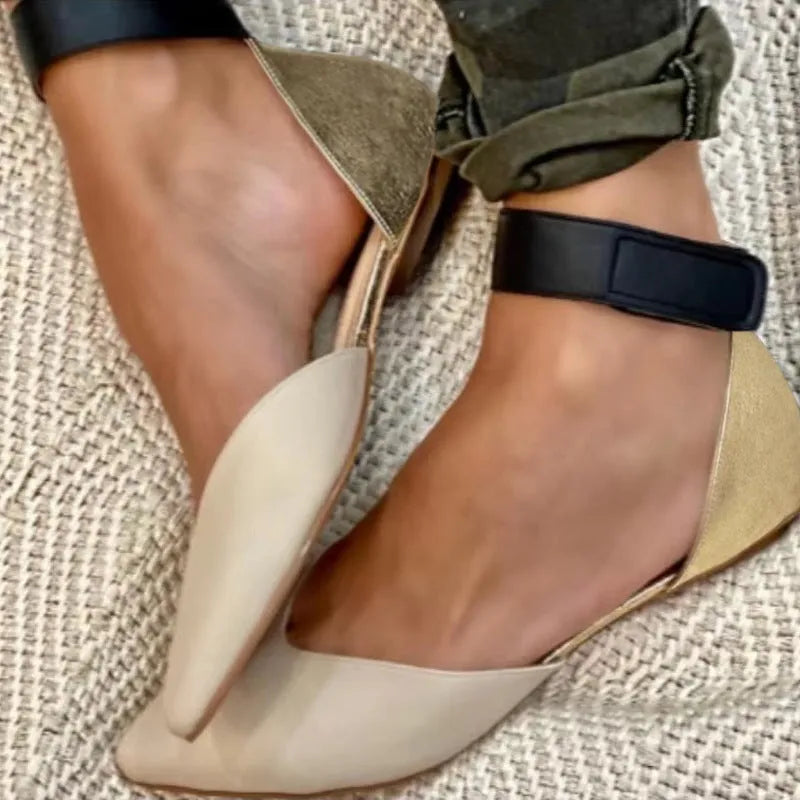 Women's flat velcro sandals in beige with a hollowed design and adjustable strap.