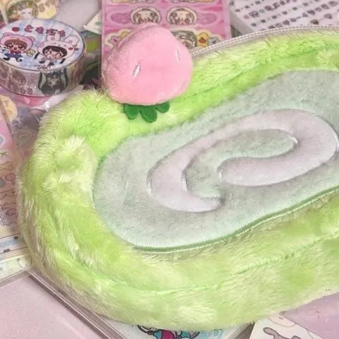 Honeydew coloured velvet pencil case with a Swiss roll cake design print.