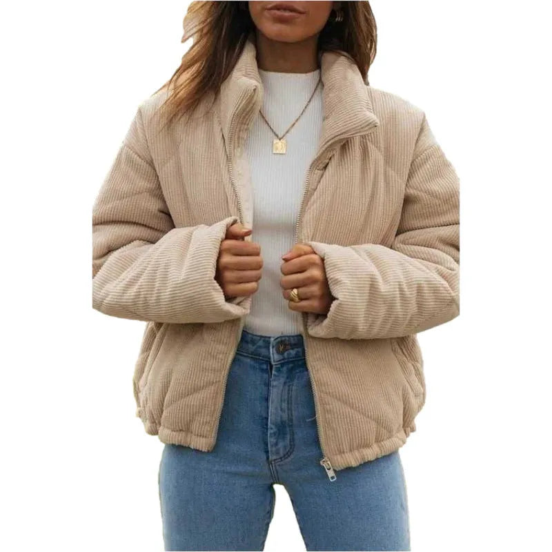 Women's apricot corduroy jacket with stand collar and front zip, showing textured fabric detail