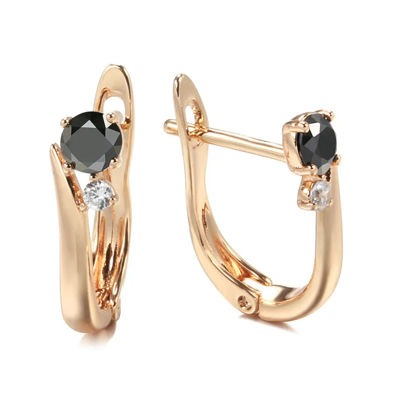 Women's gold geometric drop earrings with black agate stone effect and retro styling