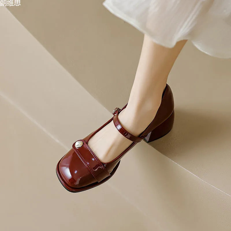 French style women's chunky heel pumps in patent leather with buckle fastening