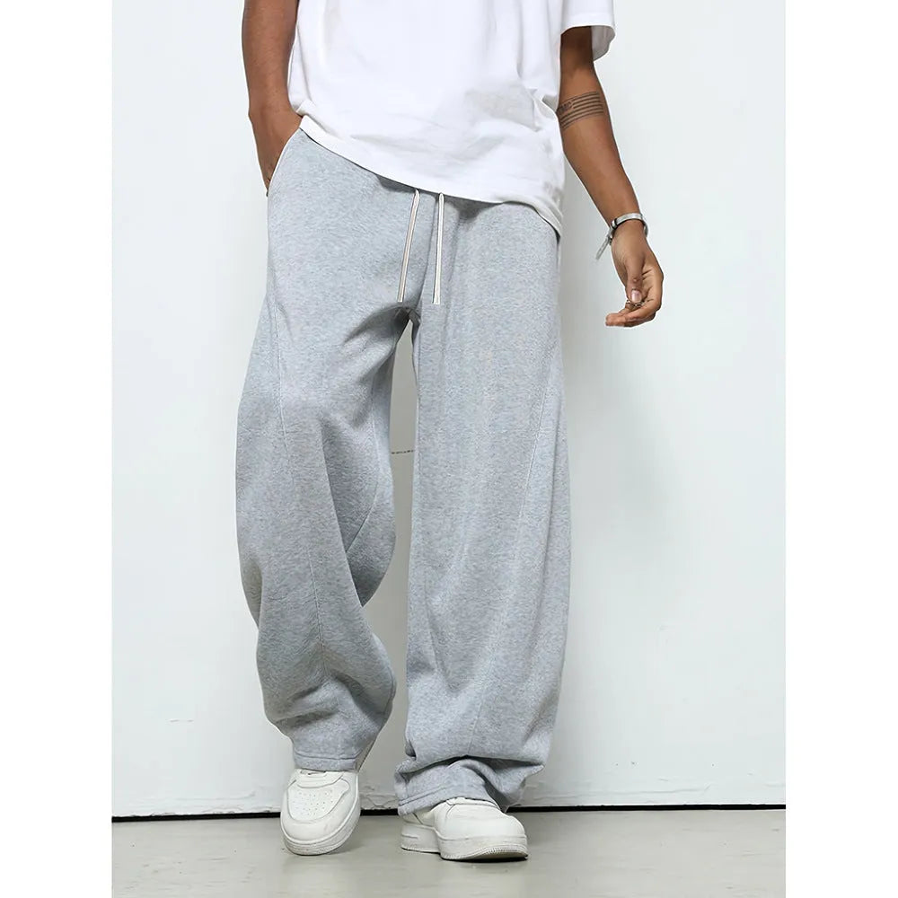 Men's straight-leg casual polyester trousers in black, shown with a drawstring waist.