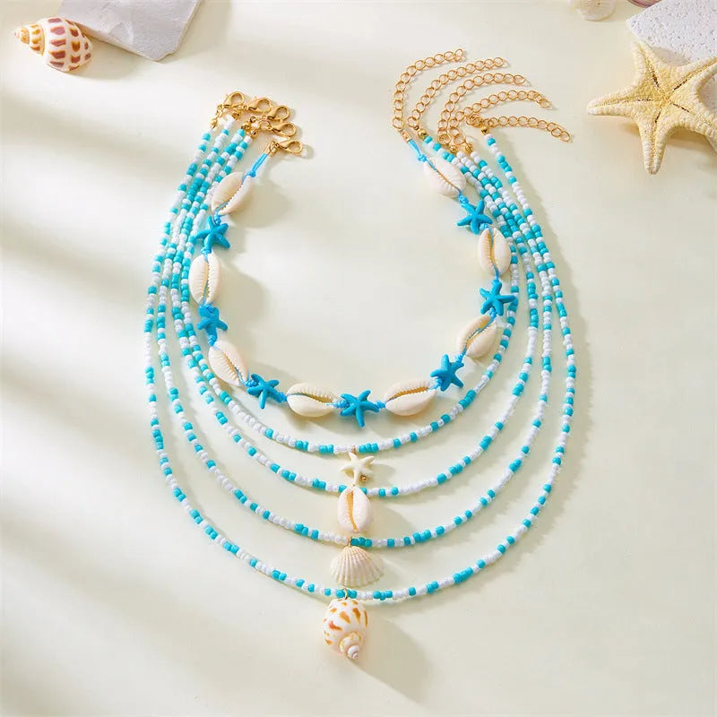 Women's multi-layer necklace set with starfish and shell pendants in blue and assorted colours