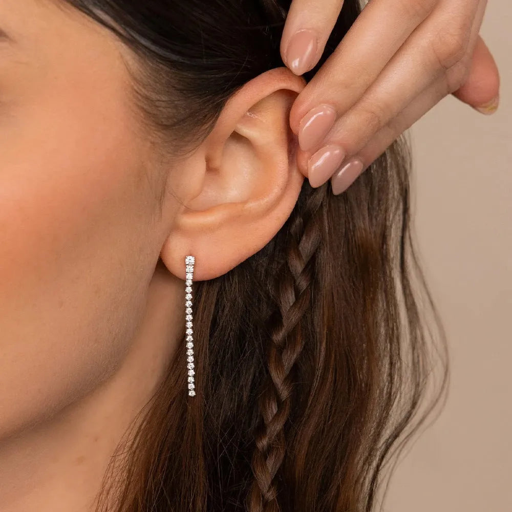 Gold and steel tone geometric women's earrings with zircon stones and line detail in Chinese style.