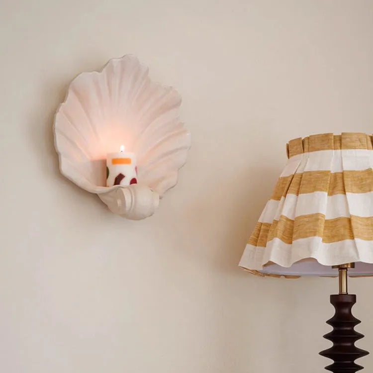 White resin decorative shell ornament for use as a fruit plate or table centrepiece.