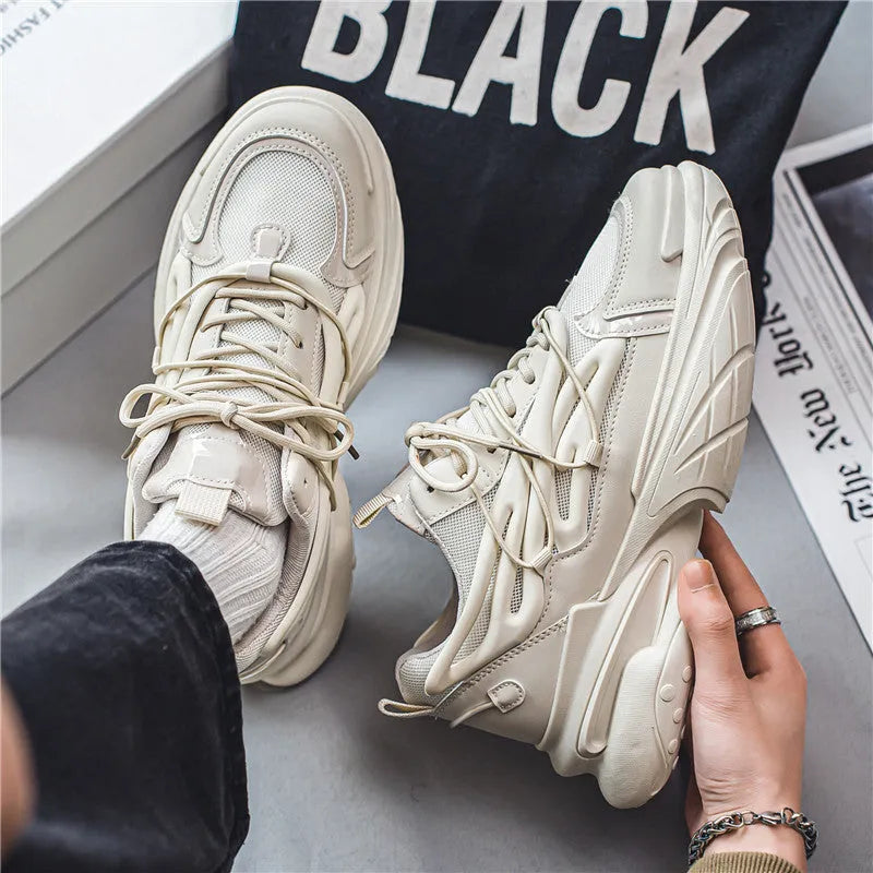 Men's low-top sneaker in beige with mesh PU leather upper, lace-up front, and a platform rubber sole.