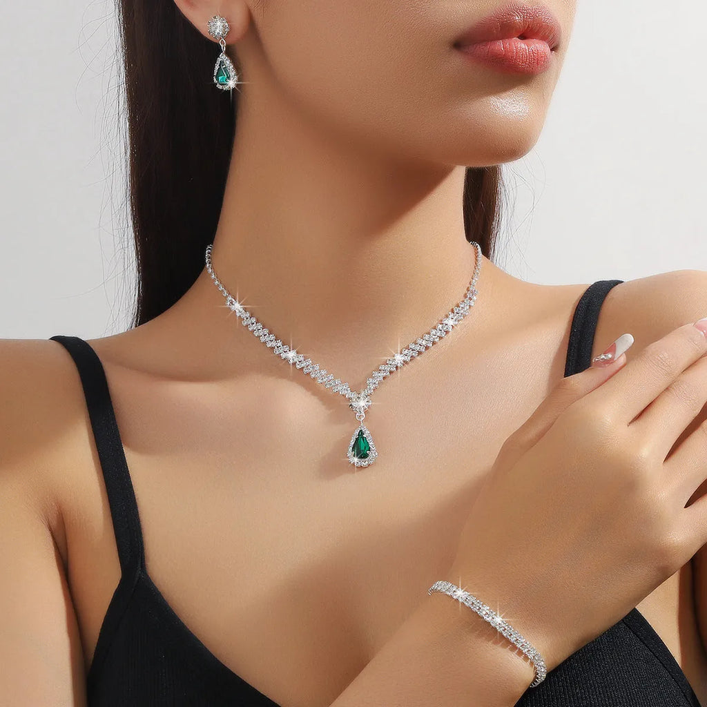 Claw chain rhinestone jewellery set with water drop shapes in a choice of colours, showing necklace, earrings, and optional bracelet.