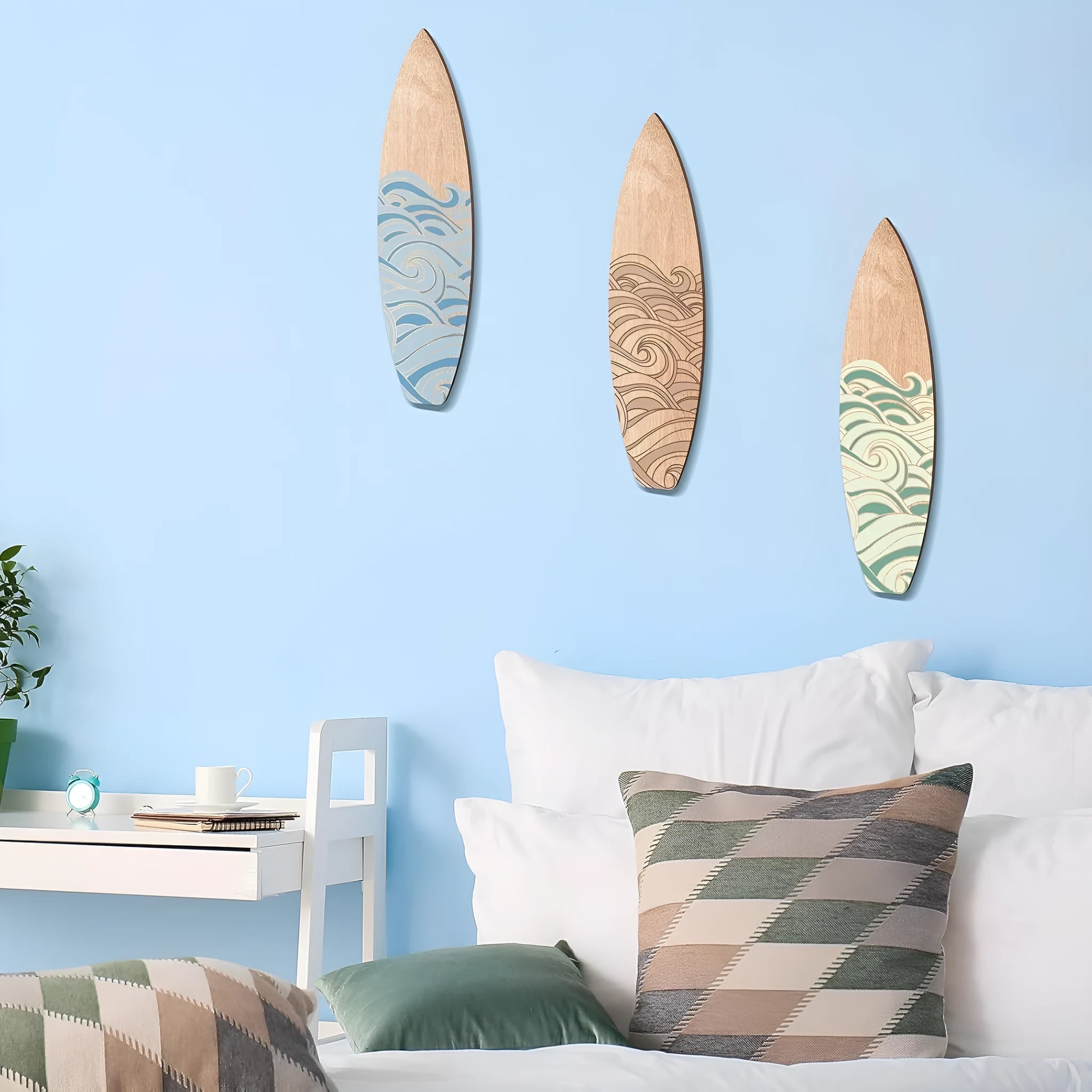 Three identical wooden surfboard wall decorations made from boxwood with European style design