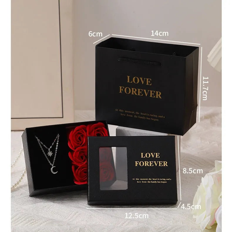 Korean-style gift box open to show six red rose-shaped soap flowers with gift handbag.