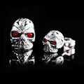 Retro style skull stud earrings with red eye ghost head design on alloy backing