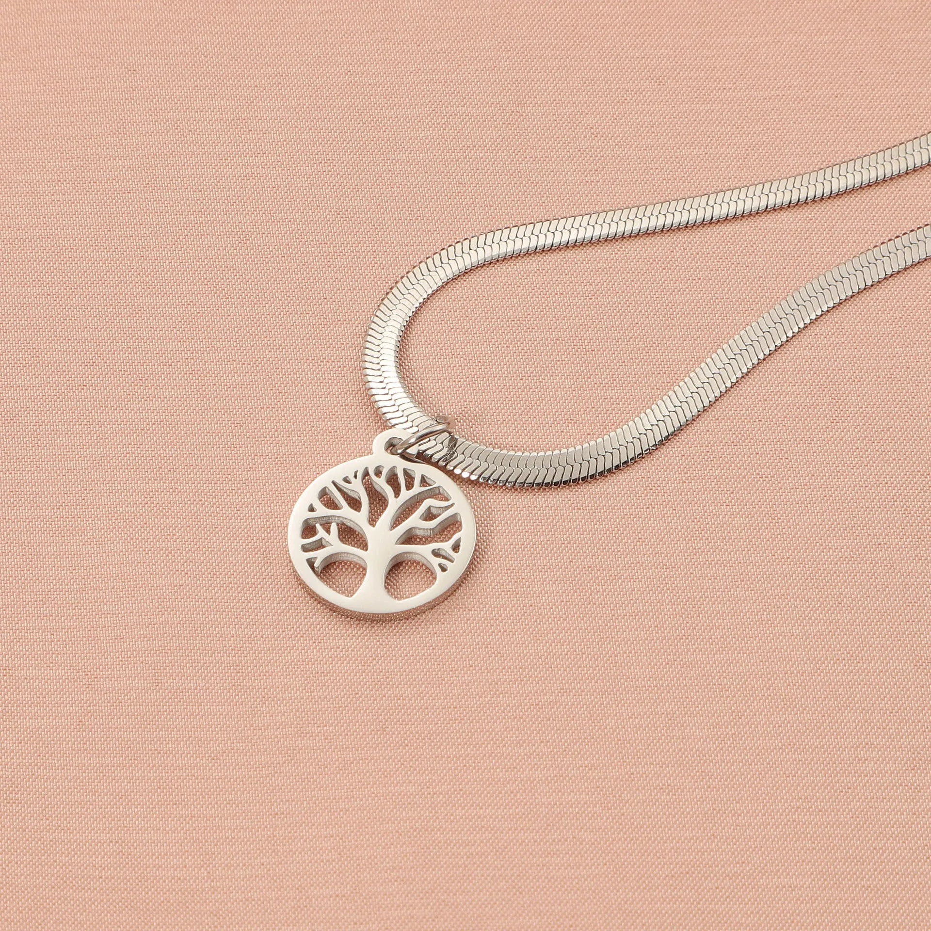 Stainless steel necklace with a U-shaped tree pendant on a snake bones chain.