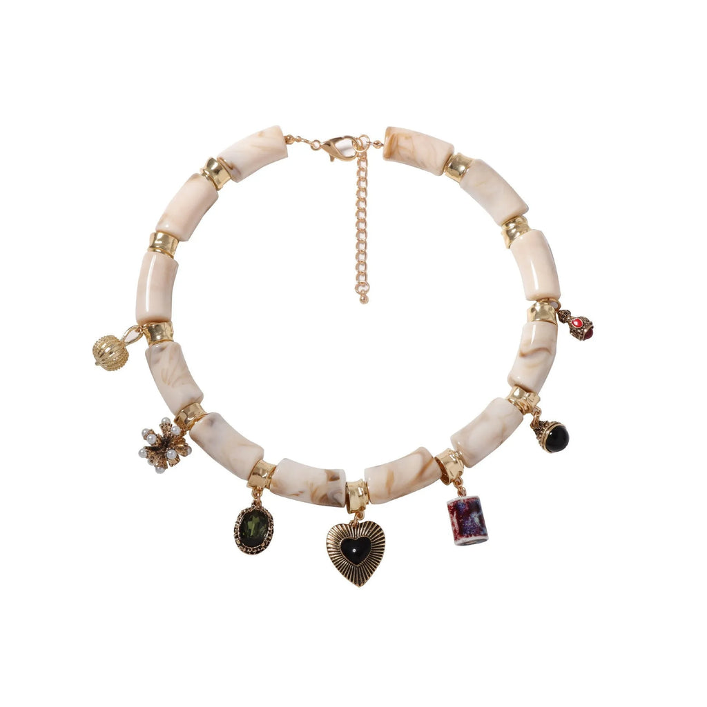 Electroplated resin bamboo heart pendant necklace with chain on white background