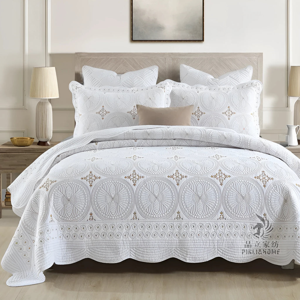 European style embroidered pure cotton bed cover set with two pillowcases on a bed
