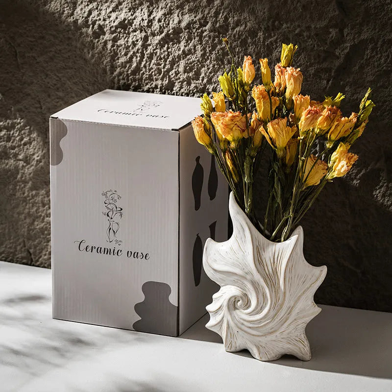 French art style ceramic vase with coloured glaze finish on a table