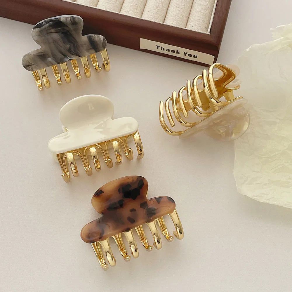 Women's retro acetate barrettes with metal grip in four colour variations including leopard print