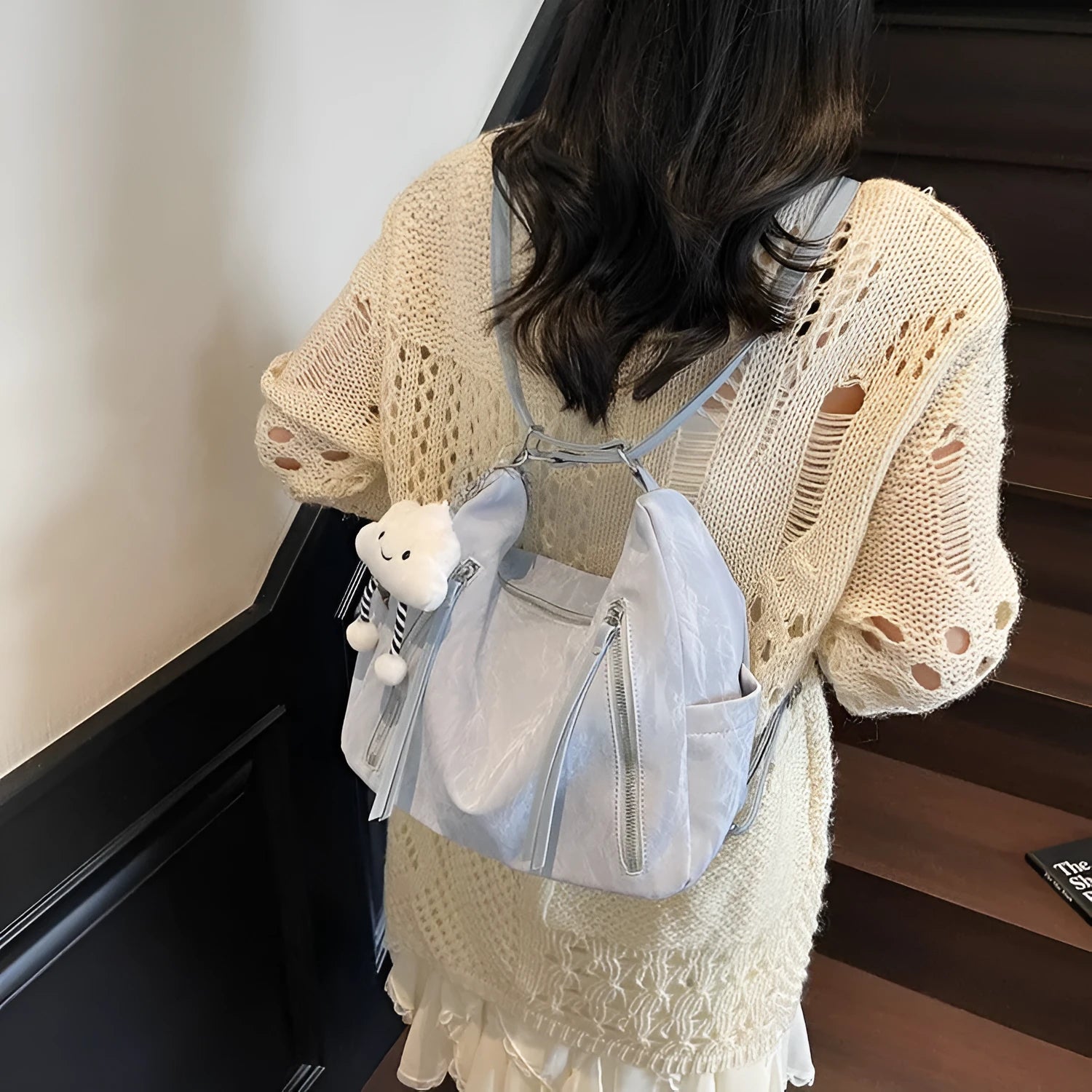 Women's soft PU fashion backpack with pendant accessory in beige, black, blue, and silver colour options