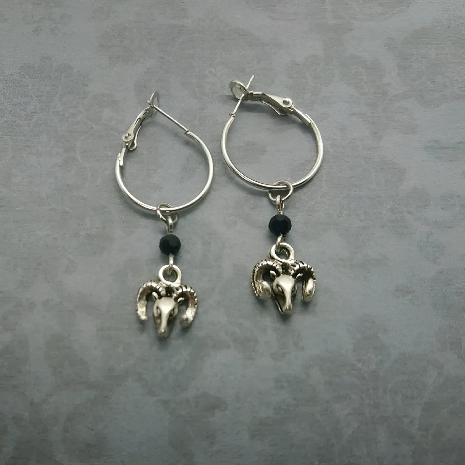 Silver colour round ring earrings with Tibetan antelope style decoration
