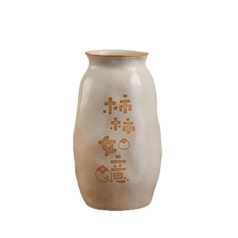 Chinese hand-painted ceramic joy vase with carved detail on desktop