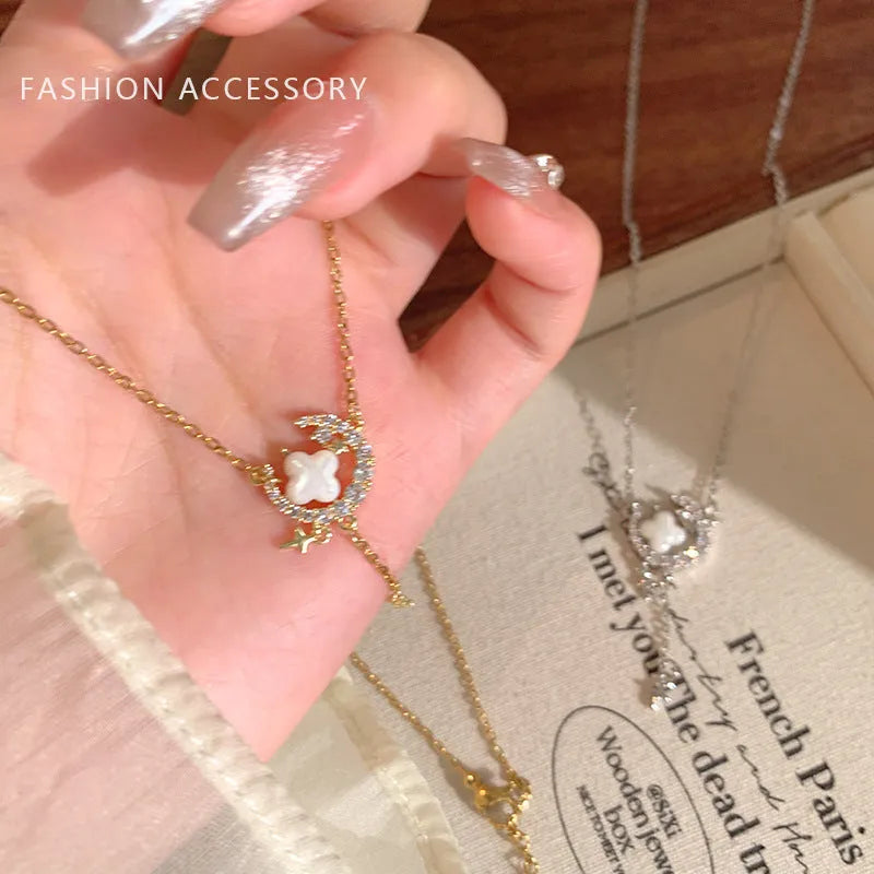 Gold and silver star moon necklace with zirconium diamonds on adjustable clavicle chain