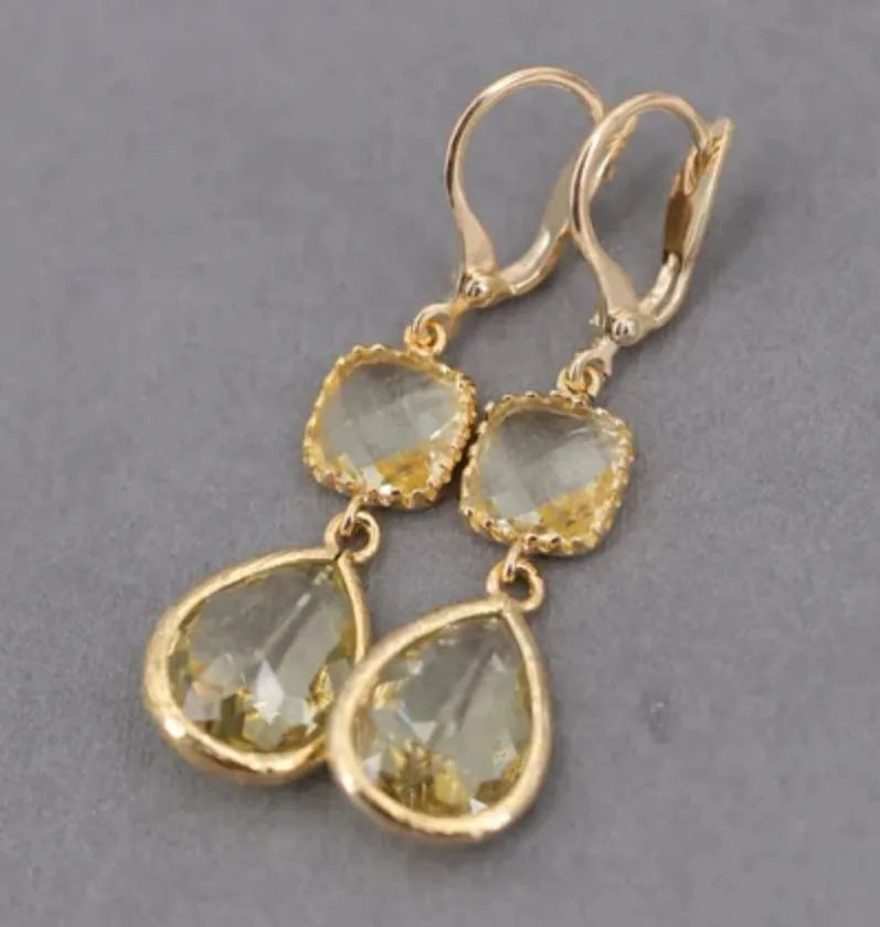 Gold geometric long fringe earrings with water droplet crystals on copper with electroplated finish