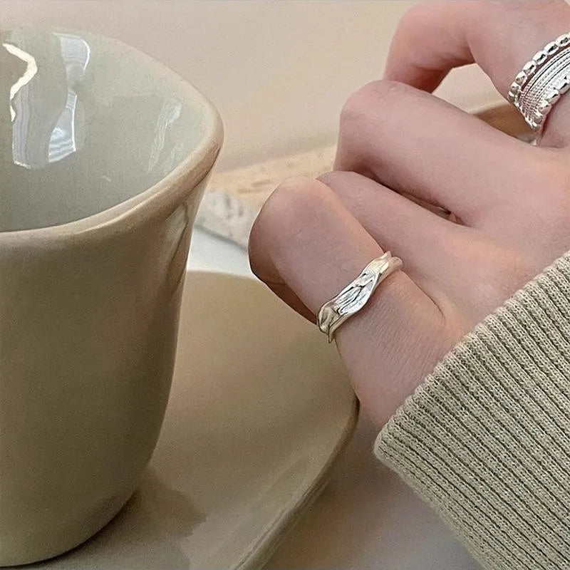 Adjustable opening copper alloy ring with geometric shape and woven twisted multilayer design