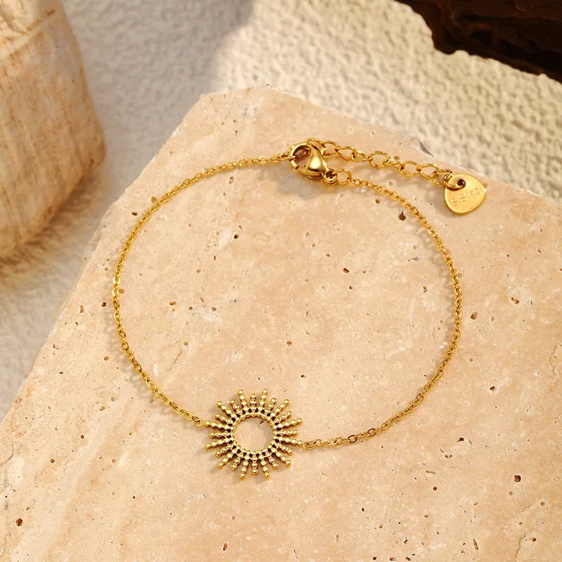 Sunflower series women's gold jewellery set showing necklace and bracelet with geometric chain design