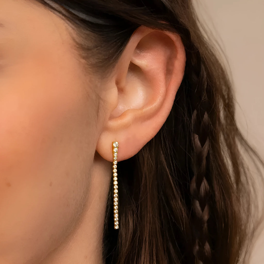 Gold and steel tone geometric women's earrings with zircon stones and line detail in Chinese style.