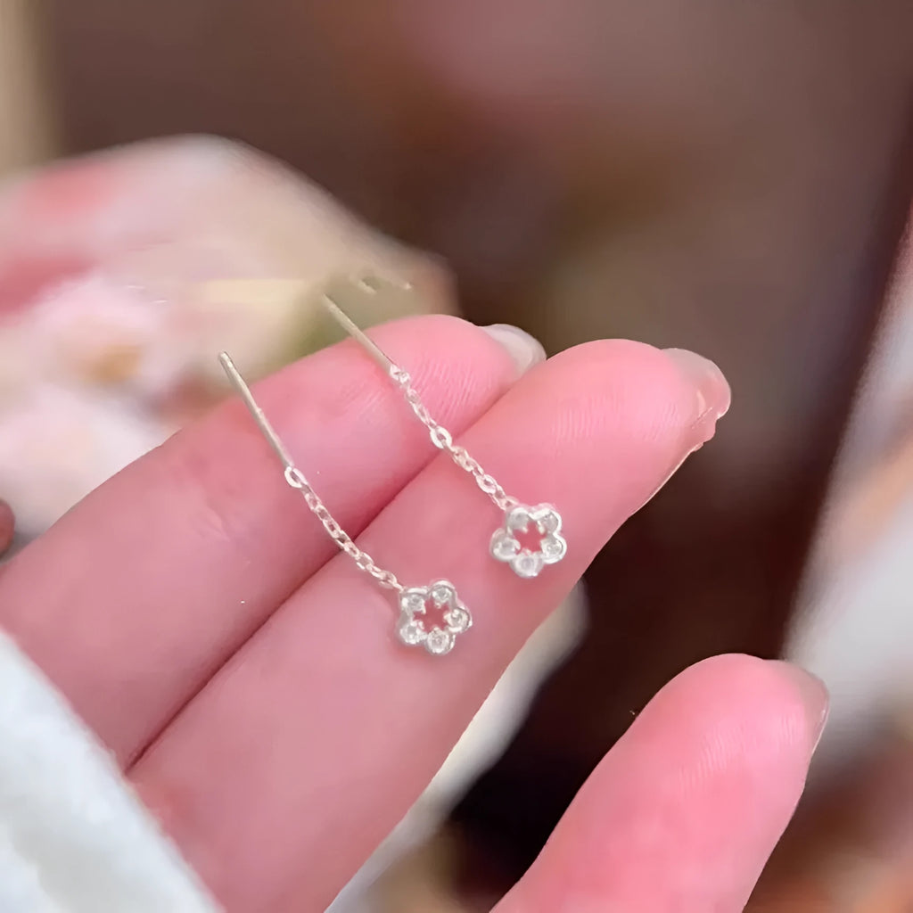 Silver colour hollow flower drop earrings with natural petal design and dangling length