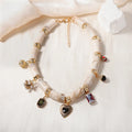 Electroplated resin bamboo heart pendant necklace with chain on white background