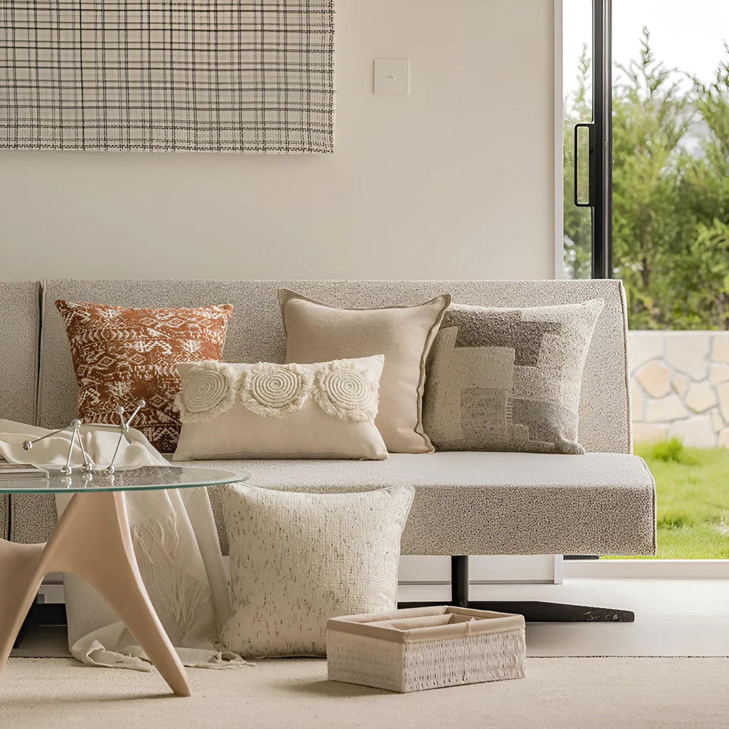 Solid colour decorative cushion on a grey sofa, showing red coffee brown and plain colour options.