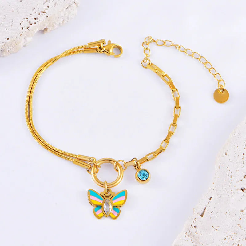 Gold titanium steel necklace and bracelet set with colourful epoxy butterfly zodiac pendant.