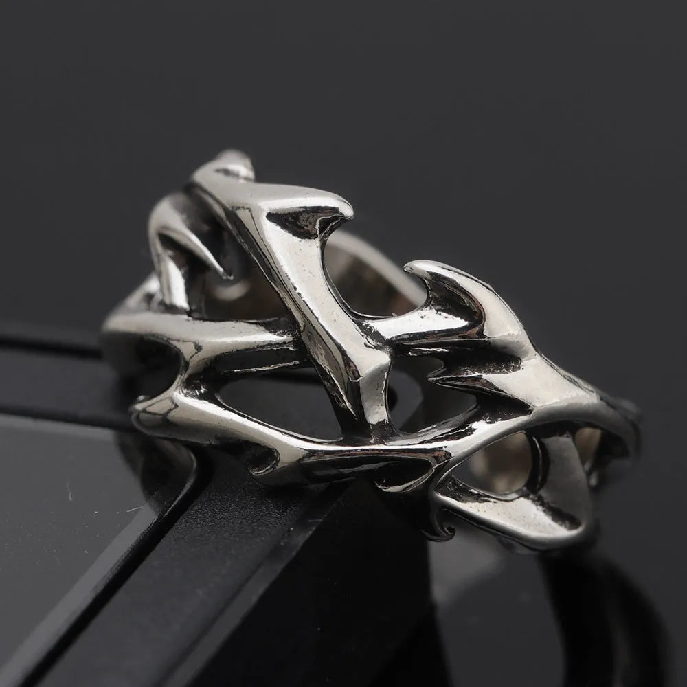 Copper geometric ring with thorn and flower design featuring adjustable opening