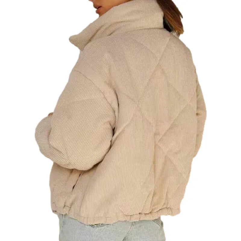 Women's apricot corduroy jacket with stand collar and front zip, showing textured fabric detail