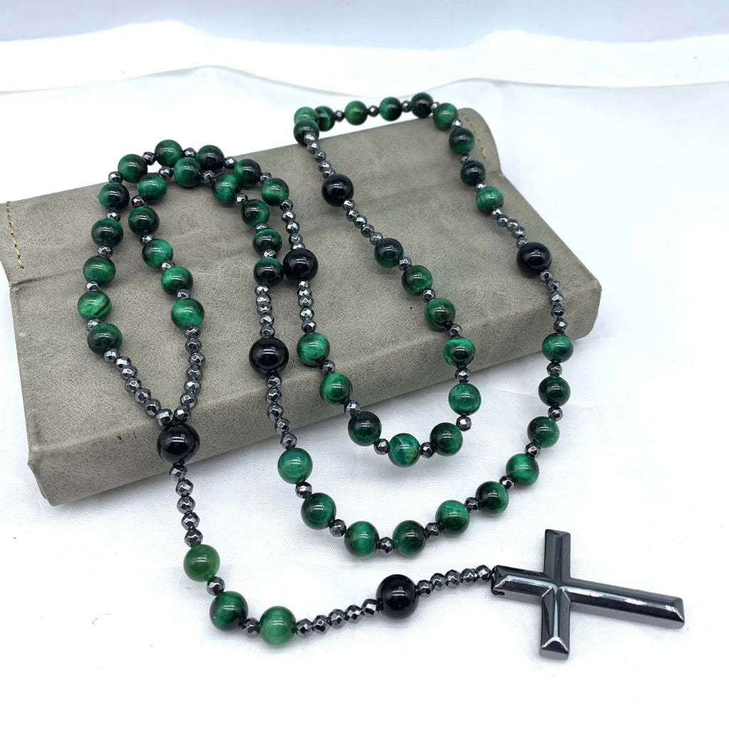 Men's stone necklace with a geometric cross pendant on a ball bead chain, showing the safety lock clasp.