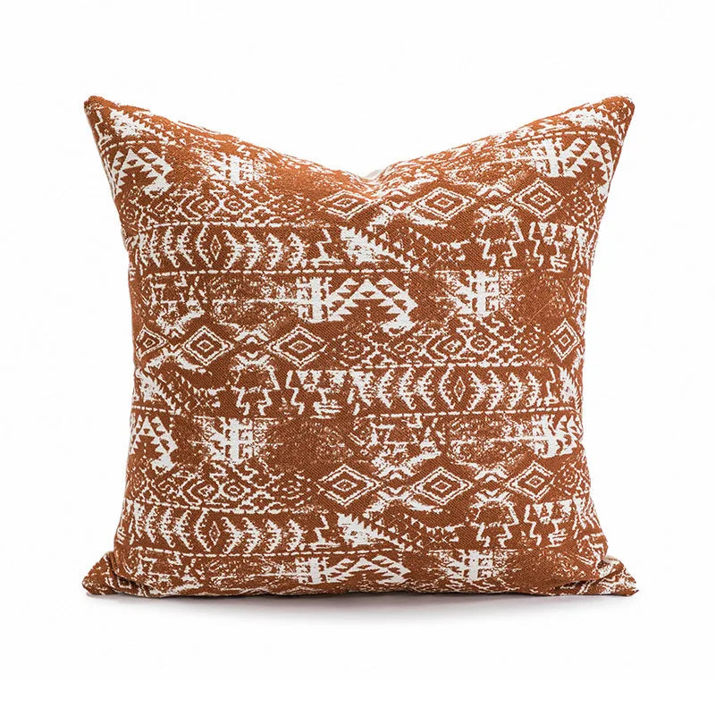 Solid colour decorative cushion on a grey sofa, showing red coffee brown and plain colour options.