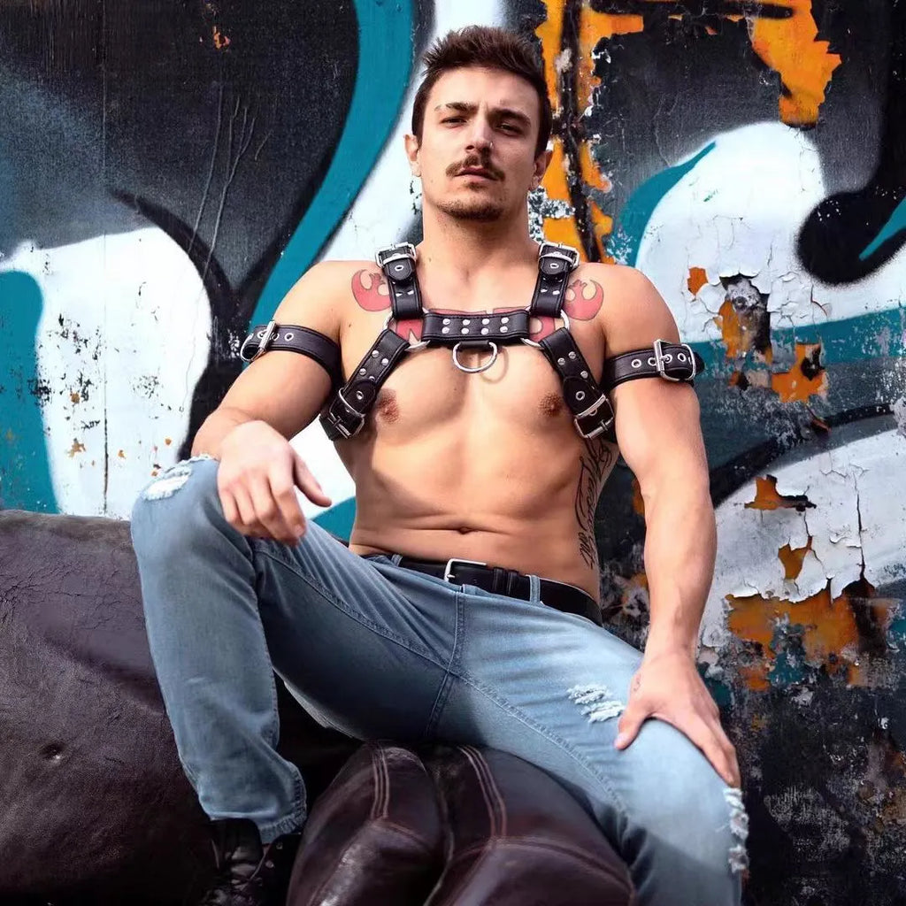 Black leather men's chest strap with metal adjustment buckle and rivets
