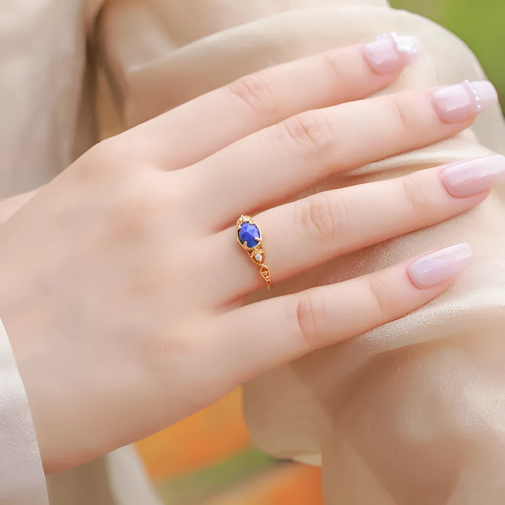 Silver alloy geometric ellipse ring with a deep blue lapis lazuli stone, Japanese style.