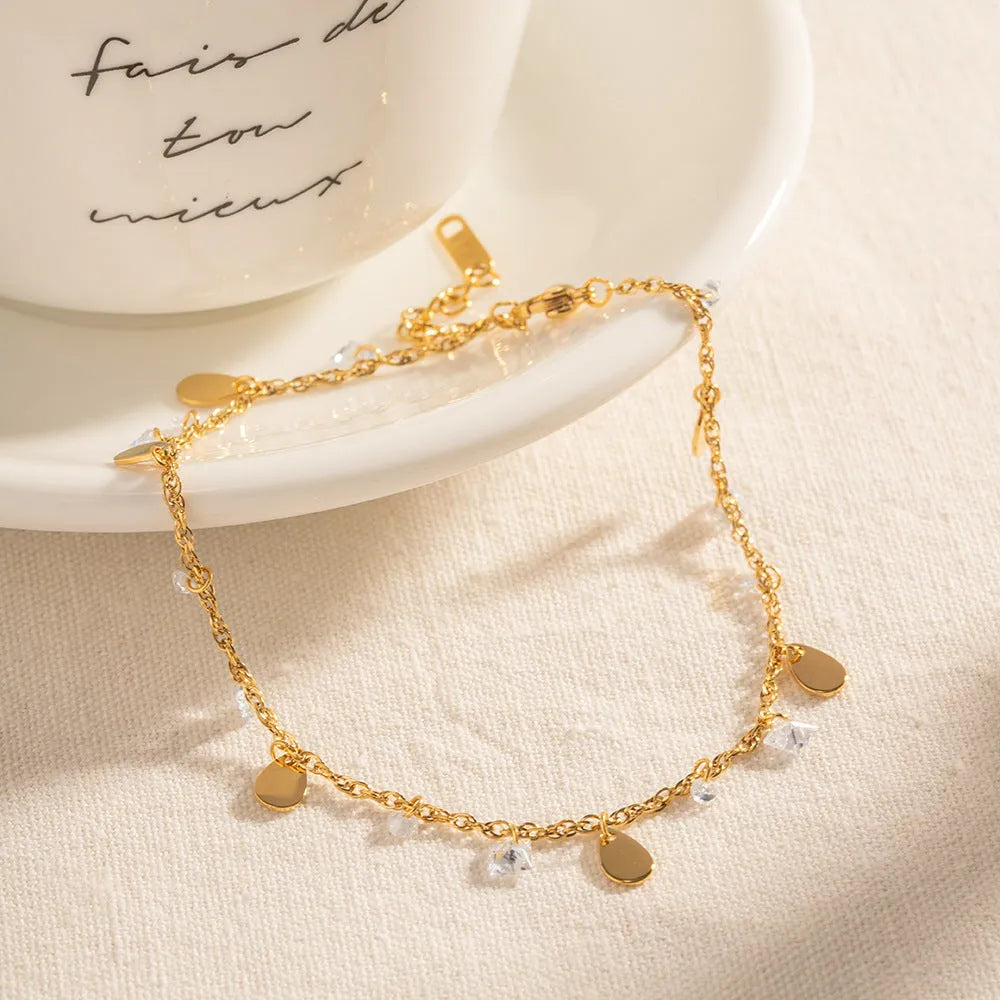 Women's stainless steel anklet with geometric water drop tassel charm on adjustable ankle bracelet