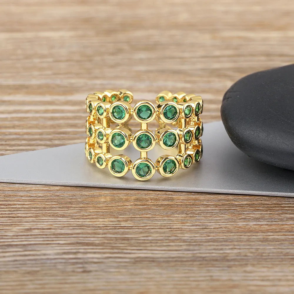 Copper ring with 18K gold plating and three-layer green zircon design in wide band version