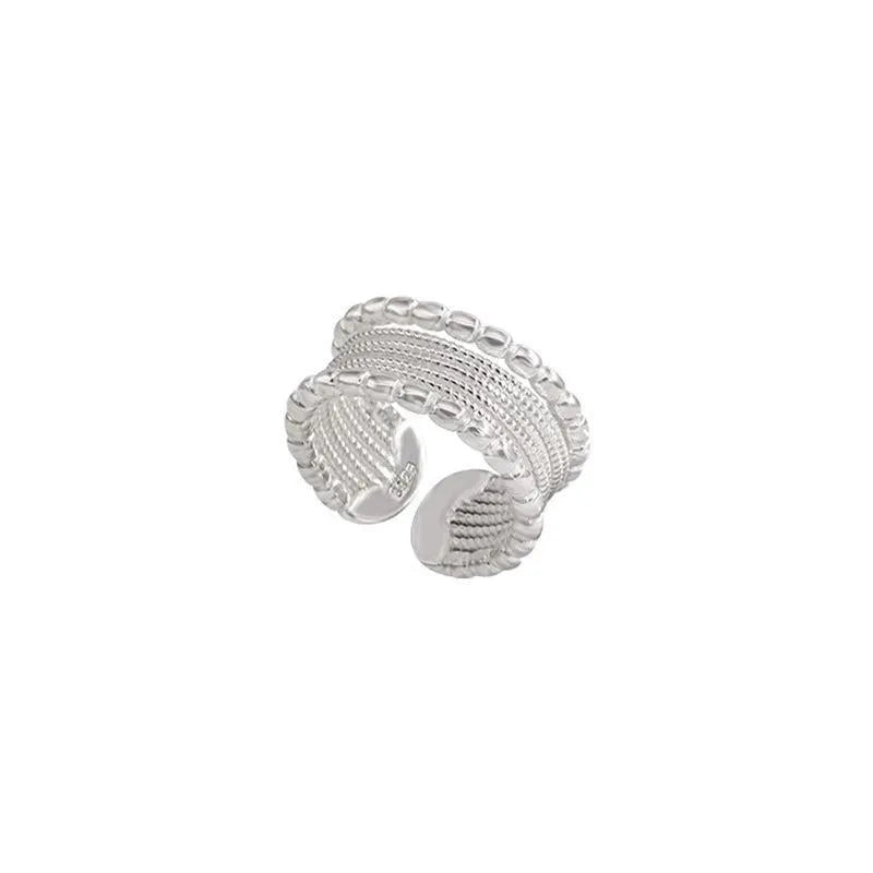 Adjustable opening copper alloy ring with geometric shape and woven twisted multilayer design