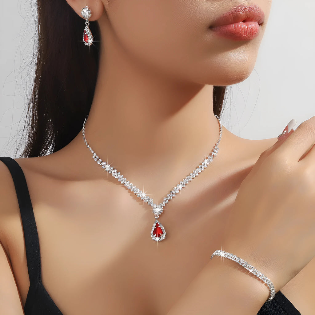 Claw chain rhinestone jewellery set with water drop shapes in a choice of colours, showing necklace, earrings, and optional bracelet.