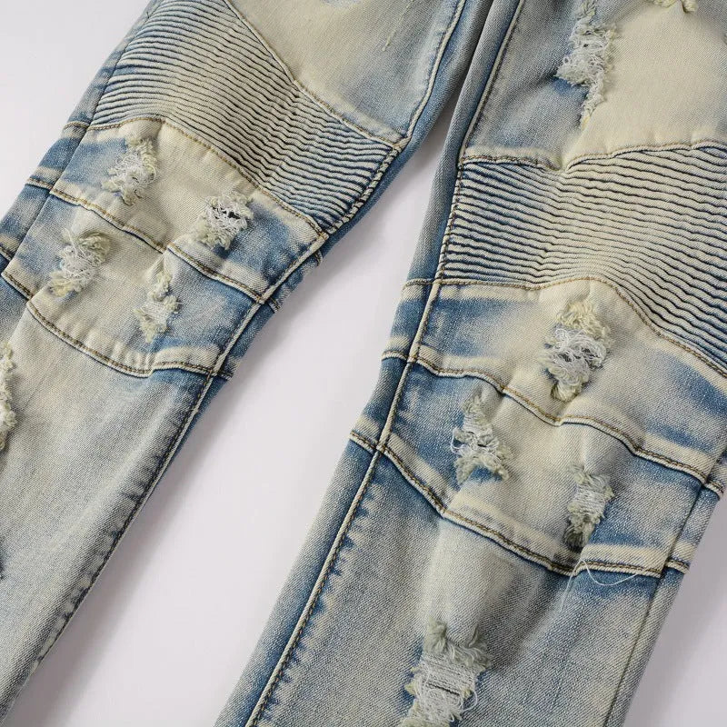 Light blue men's slim fit distressed jeans with hand-frayed detailing on the knees and hem.
