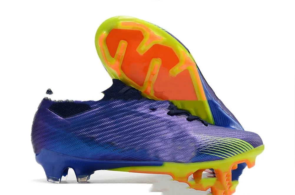 Men's low-top football shoes with knitted waterproof upper, lace-up front, and rubber FG studded sole