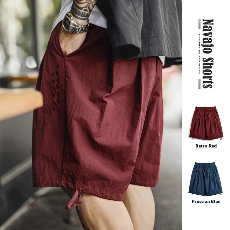 Men's loose fit beach shorts with embroidery in Prussian blue colour