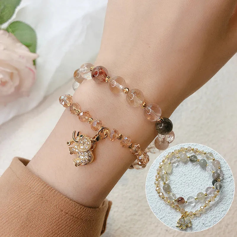 Women's retro bracelet with strawberry quartz hair crystal stones showing 521 colour variations